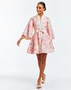 Linen mini dress with butterfly sleeves, hand pockets, and front bow detail. Featuring a mandarin collar and a pink toile print. 