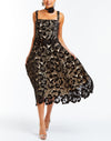 Black velvet laser cut lace skirt with natural scalloped hemline and side pockets. 