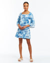 Blue and white tropical toile print mini dress with ¾ length bell sleeves with ruffle detail. 