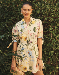 Verdant Blooms cotton poplin mini dress with mandarin collar, fitted waist, A-line skirt, and elbow-length tie sleeves.