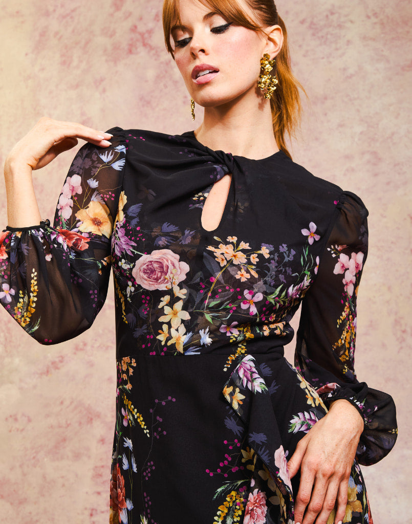 Ophelia Chiffon Gown in Twilight Florals front – chiffon evening gown with twisted keyhole neckline, sheer balloon sleeves, and cascading ruffle skirt by Mestiza New York.