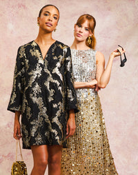 Ines Caftan Mini Dress in Black/Gold front – metallic lurex cocktail shift dress with djellaba collar, bell sleeves, and side seam pockets by Mestiza New York.