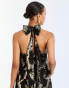 Adelina Gown in Black/Gold detail – metallic jacquard evening gown with halter bow neckline, faux ruffle back, A-line silhouette, and side seam pockets by Mestiza New York.