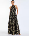 Adelina Gown in Black/Gold front – metallic jacquard evening gown with halter bow neckline, faux ruffle back, A-line silhouette, and side seam pockets by Mestiza New York.