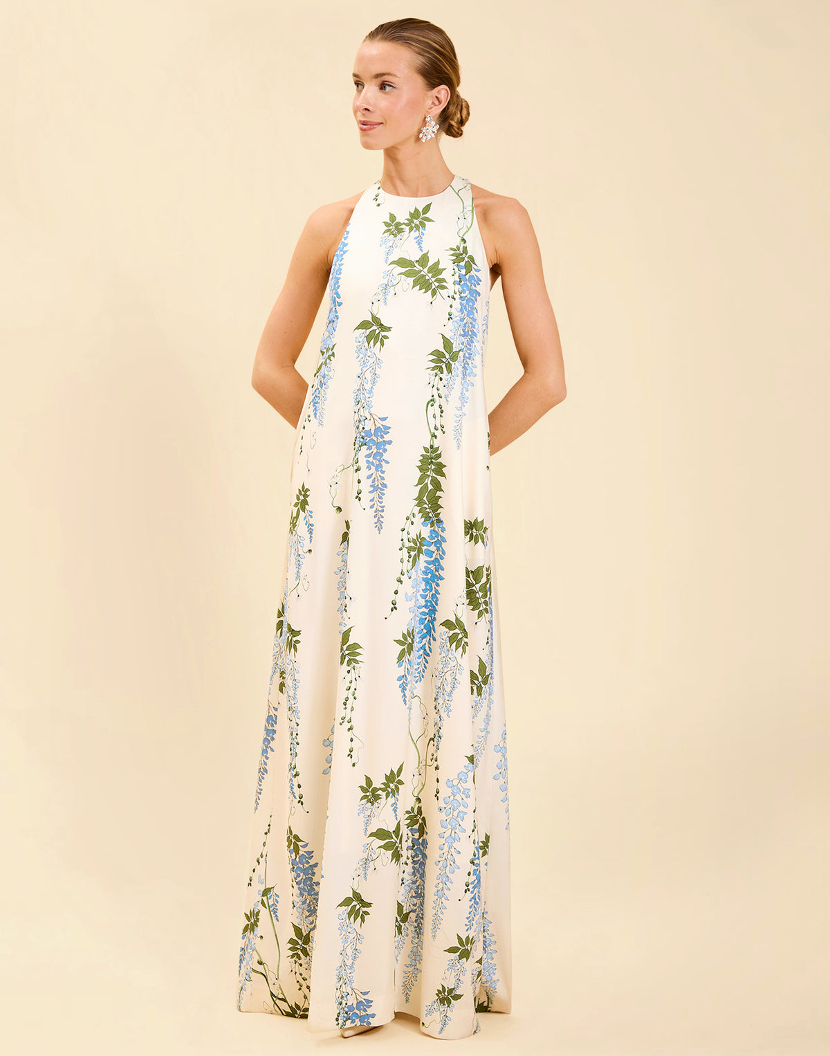 Adelina Gown in Wisteria Toile stretch crepe with halter neckline, cascading bow back detail, A-line silhouette, and hidden side pockets.