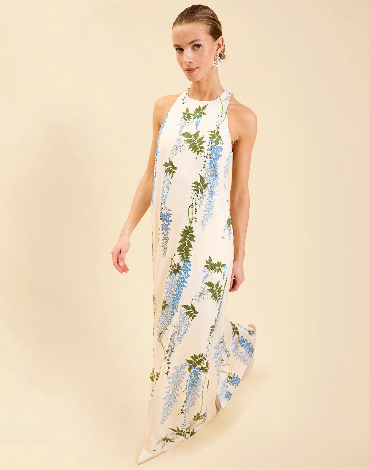 Adelina Gown in Wisteria Toile stretch crepe with halter neckline, cascading bow back detail, A-line silhouette, and hidden side pockets.