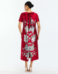 Adria Midi Dress in Burgundy Arbor back – metallic jacquard cocktail midi dress with column silhouette, boat neckline, short sleeves, and bow back detail by Mestiza New York.