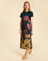 Adria Midi Dress in Demitasse Flowers with a boat neckline, fitted short sleeves, and column silhouette.
