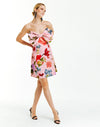 pink strapless mini dress with bold pink garden floral print and oversized front bow detail.