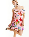 pink strapless mini dress with bold pink garden floral print and oversized front bow detail.