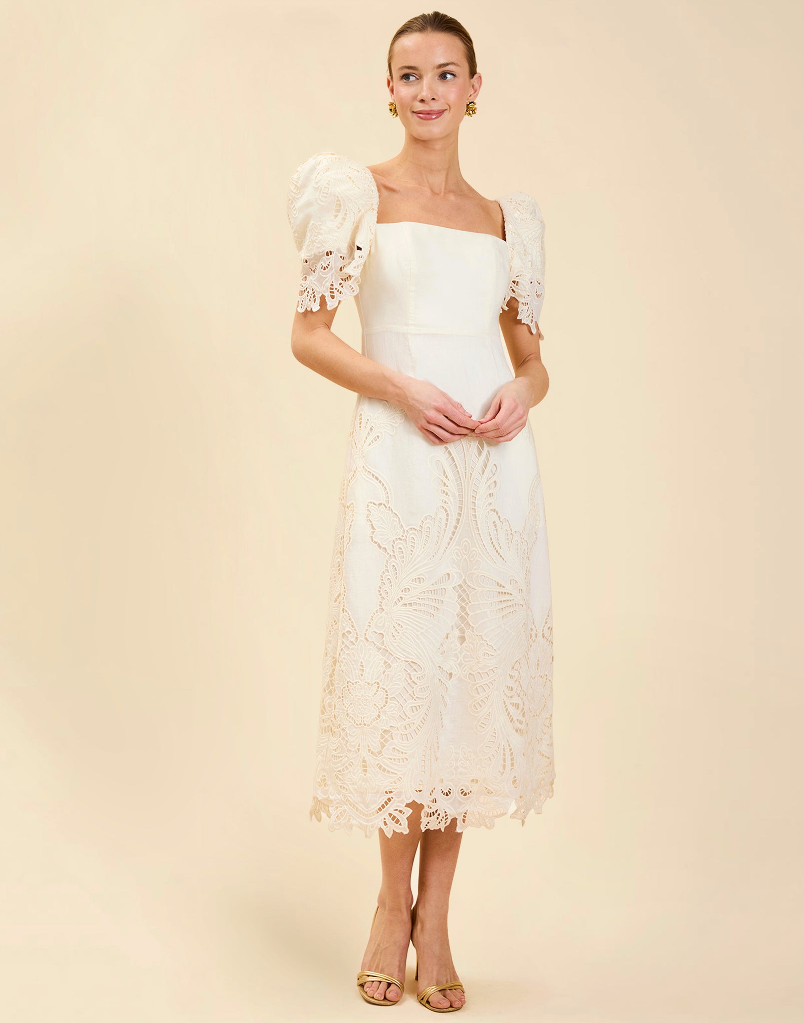 Alessandra Terno Midi Dress in Ivory broderie anglaise lace with sculptural terno sleeves, scalloped neckline, and elegant column midi silhouette.