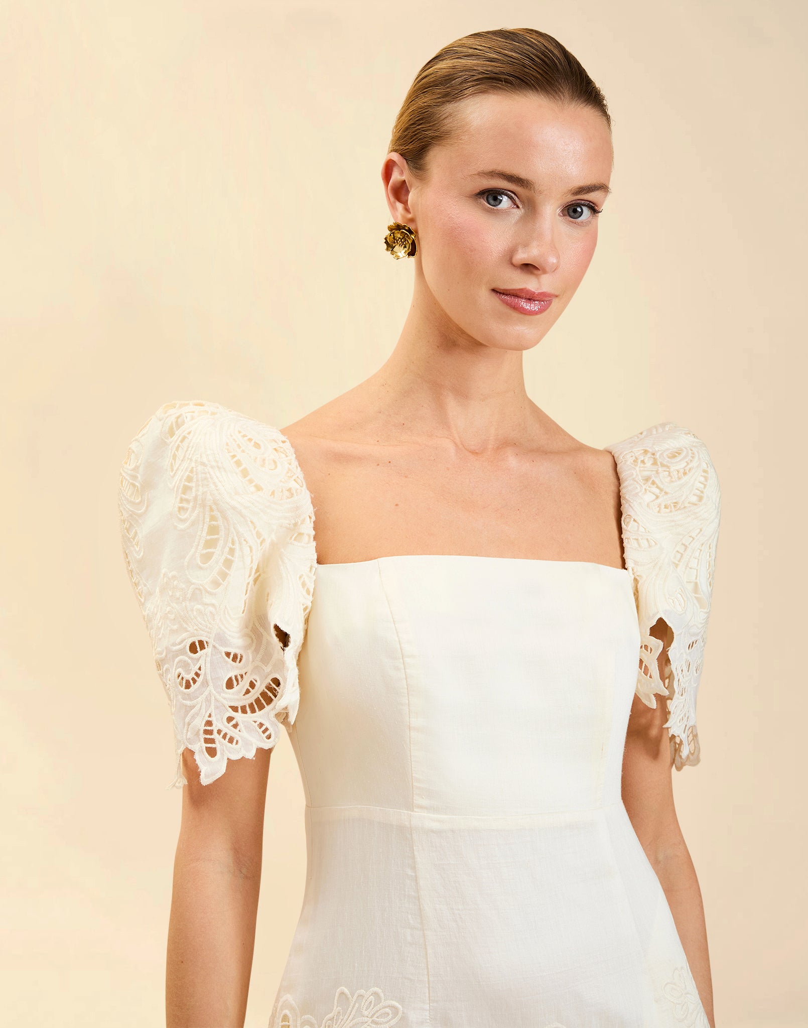 Alessandra Terno Midi Dress in Ivory broderie anglaise lace with sculptural terno sleeves, scalloped neckline, and elegant column midi silhouette.