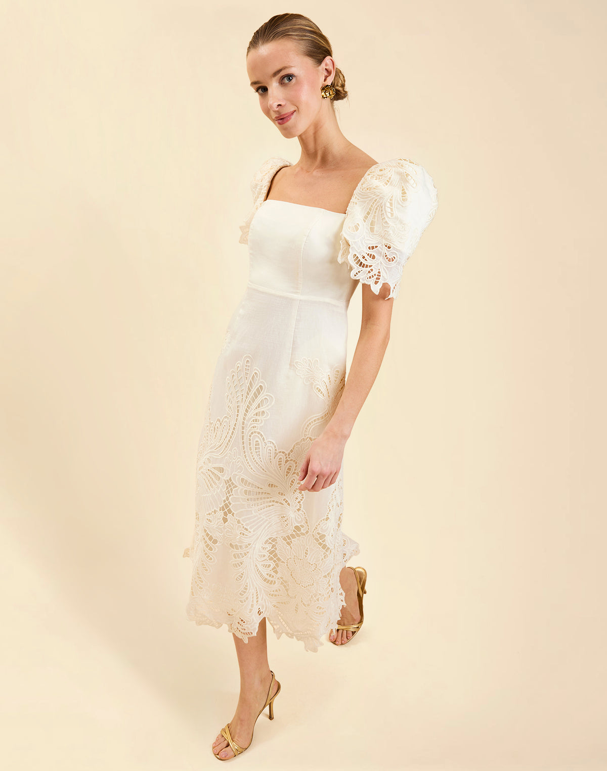 Alessandra Terno Midi Dress in Ivory broderie anglaise lace with sculptural terno sleeves, scalloped neckline, and elegant column midi silhouette.