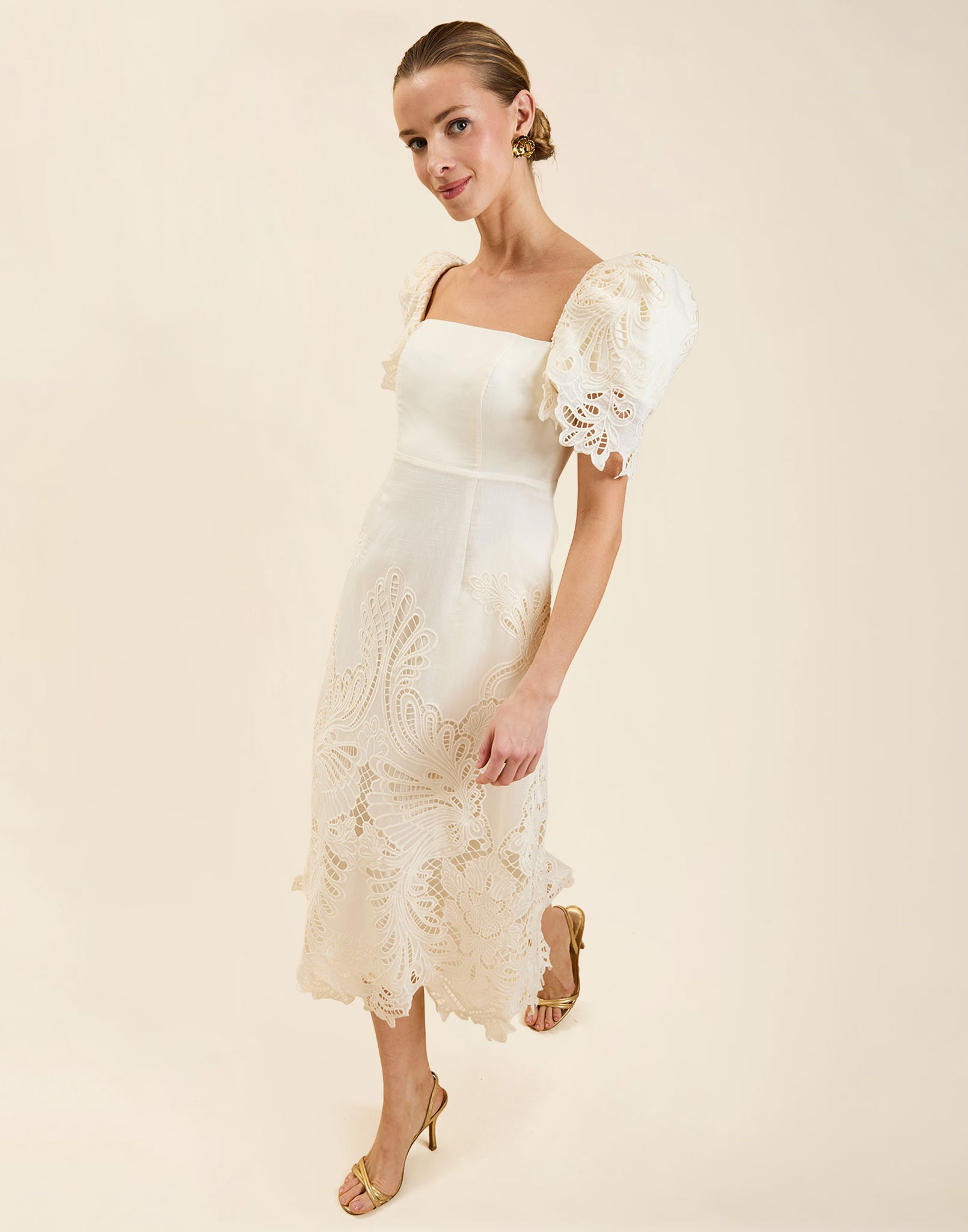 Alessandra Terno Midi Dress in Ivory broderie anglaise lace with sculptural terno sleeves, scalloped neckline, and elegant column midi silhouette.
