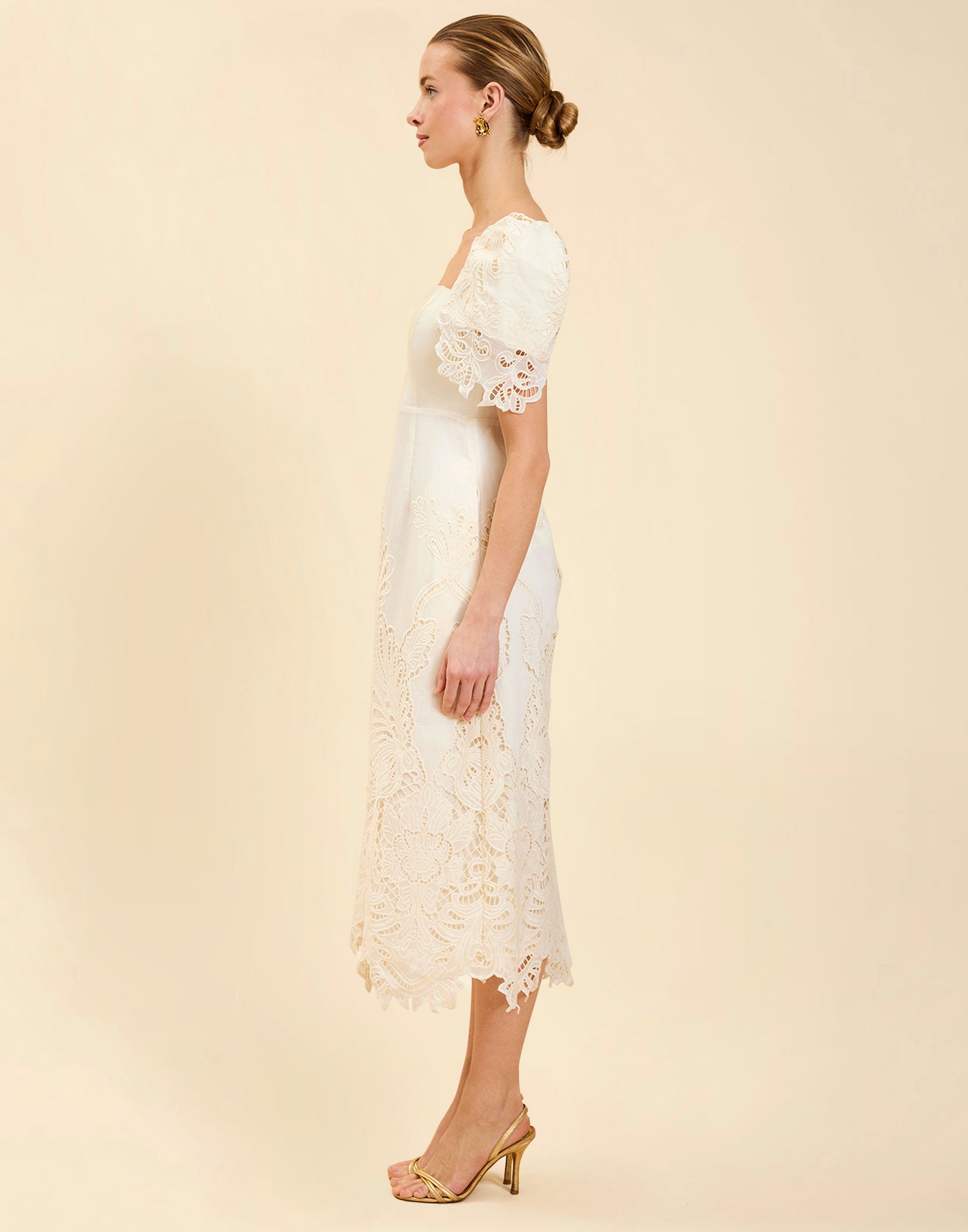 Alessandra Terno Midi Dress in Ivory broderie anglaise lace with sculptural terno sleeves, scalloped neckline, and elegant column midi silhouette.
