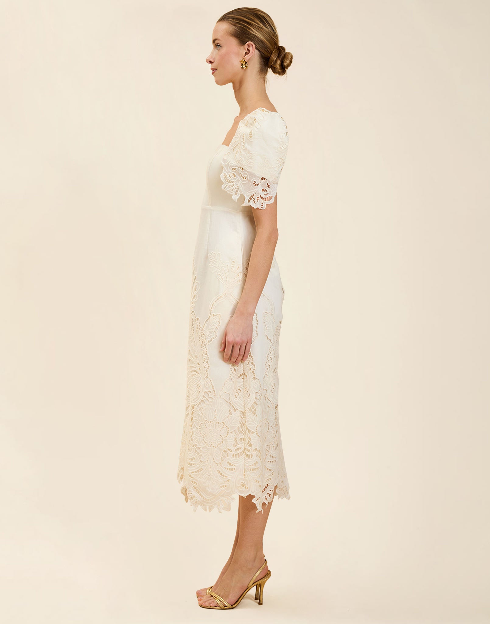 Alessandra Terno Midi Dress in Ivory broderie anglaise lace with sculptural terno sleeves, scalloped neckline, and elegant column midi silhouette.