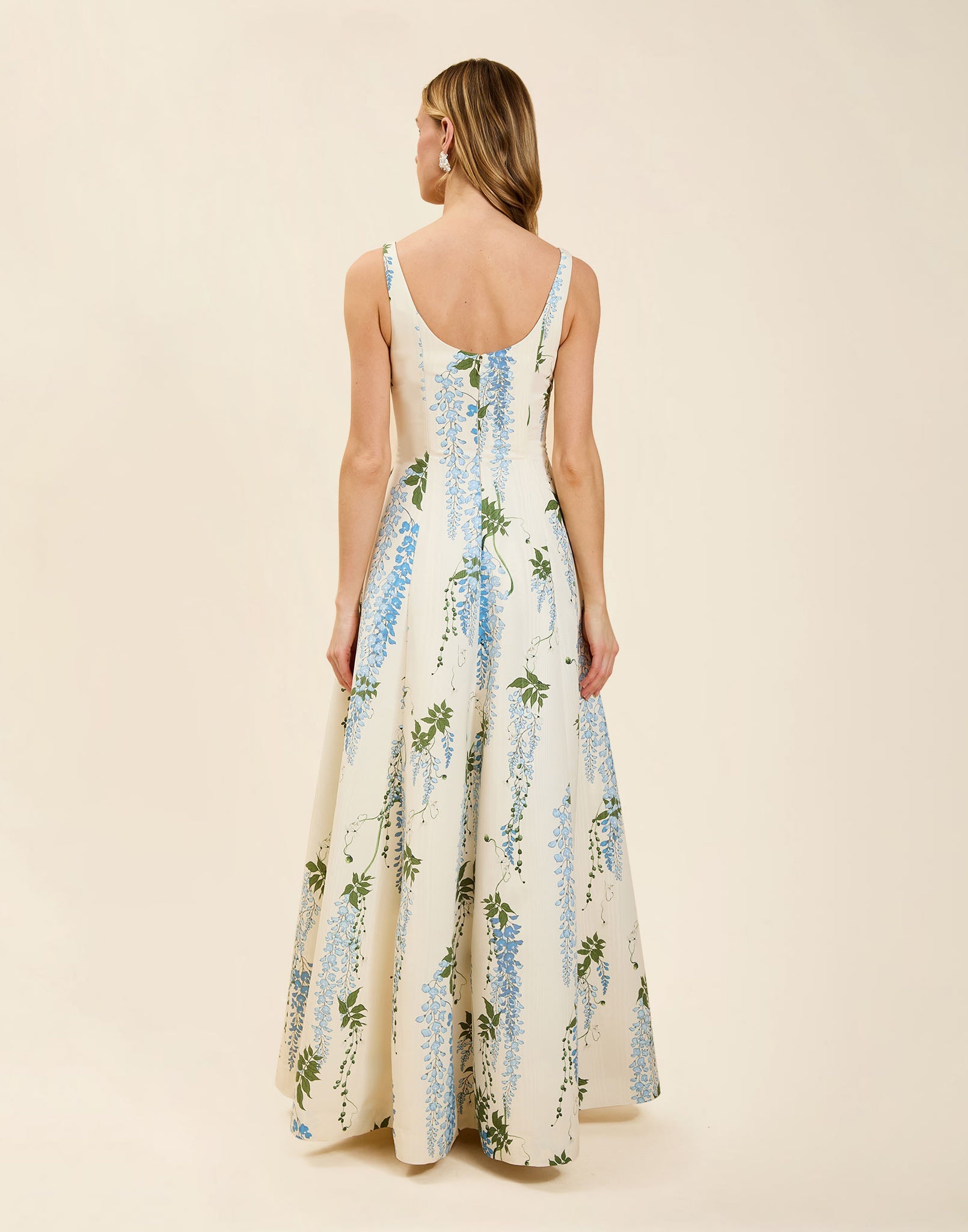 Amanda Gown in Wisteria Toile moiré with deep scoop neckline, sleeveless bodice, A-line silhouette, and hidden side pockets.