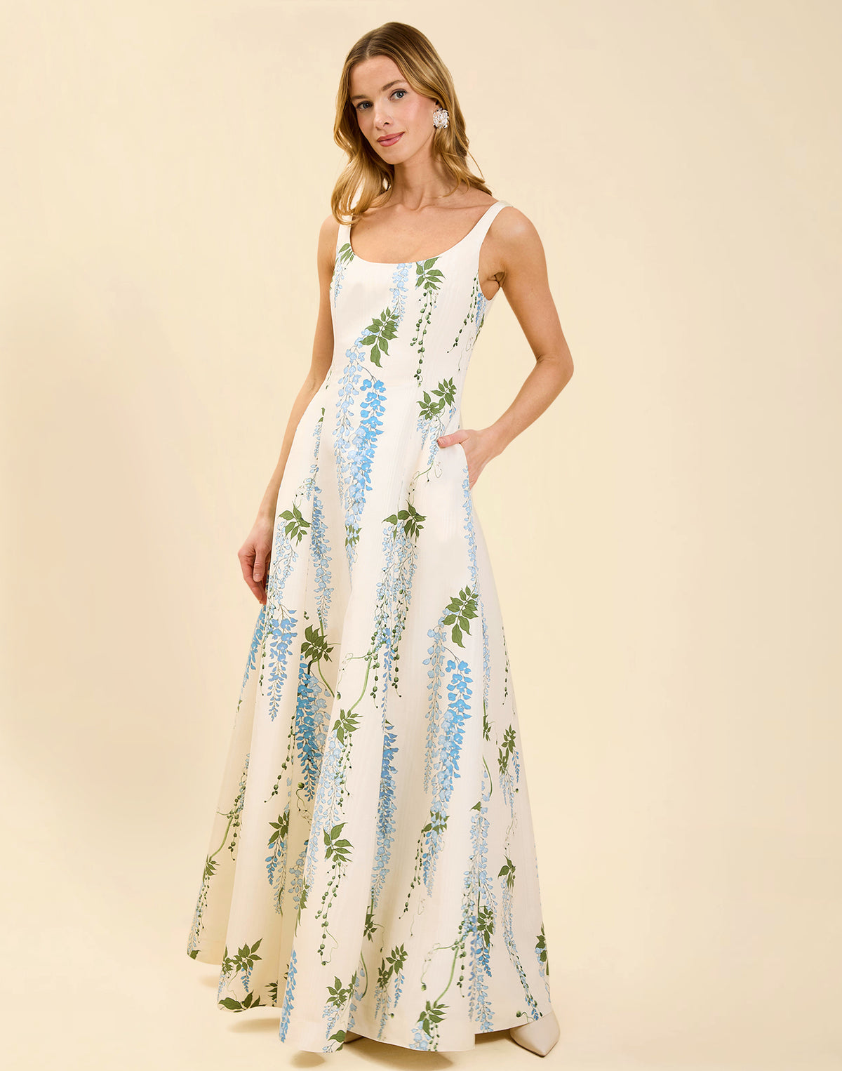 Amanda Gown in Wisteria Toile moiré with deep scoop neckline, sleeveless bodice, A-line silhouette, and hidden side pockets.