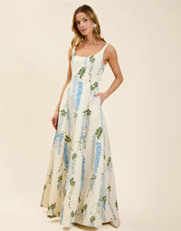 Amanda Gown in Wisteria Toile moiré with deep scoop neckline, sleeveless bodice, A-line silhouette, and hidden side pockets.