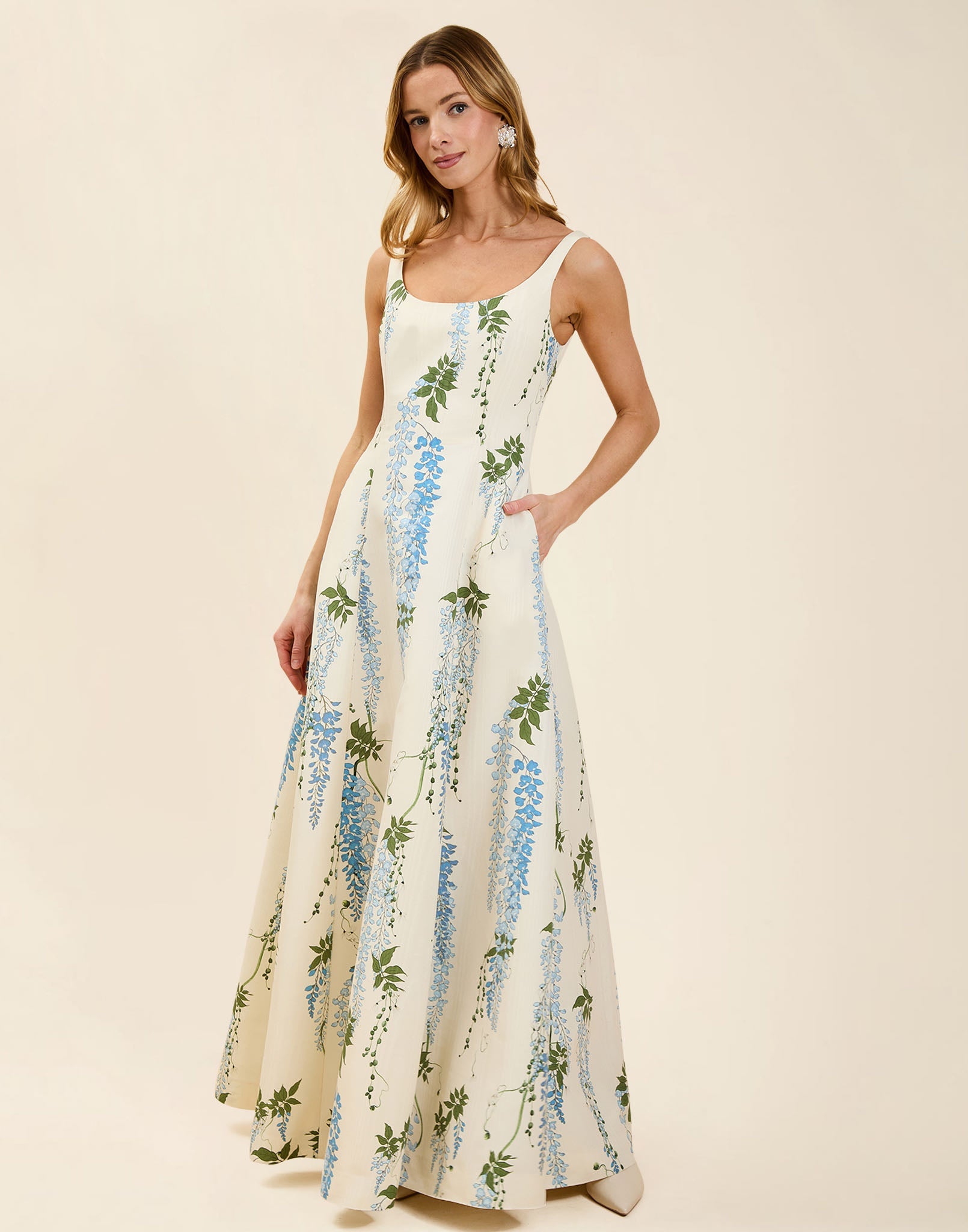 Amanda Gown in Wisteria Toile moiré with deep scoop neckline, sleeveless bodice, A-line silhouette, and hidden side pockets.