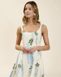 Amanda Gown in Wisteria Toile moiré with deep scoop neckline, sleeveless bodice, A-line silhouette, and hidden side pockets.