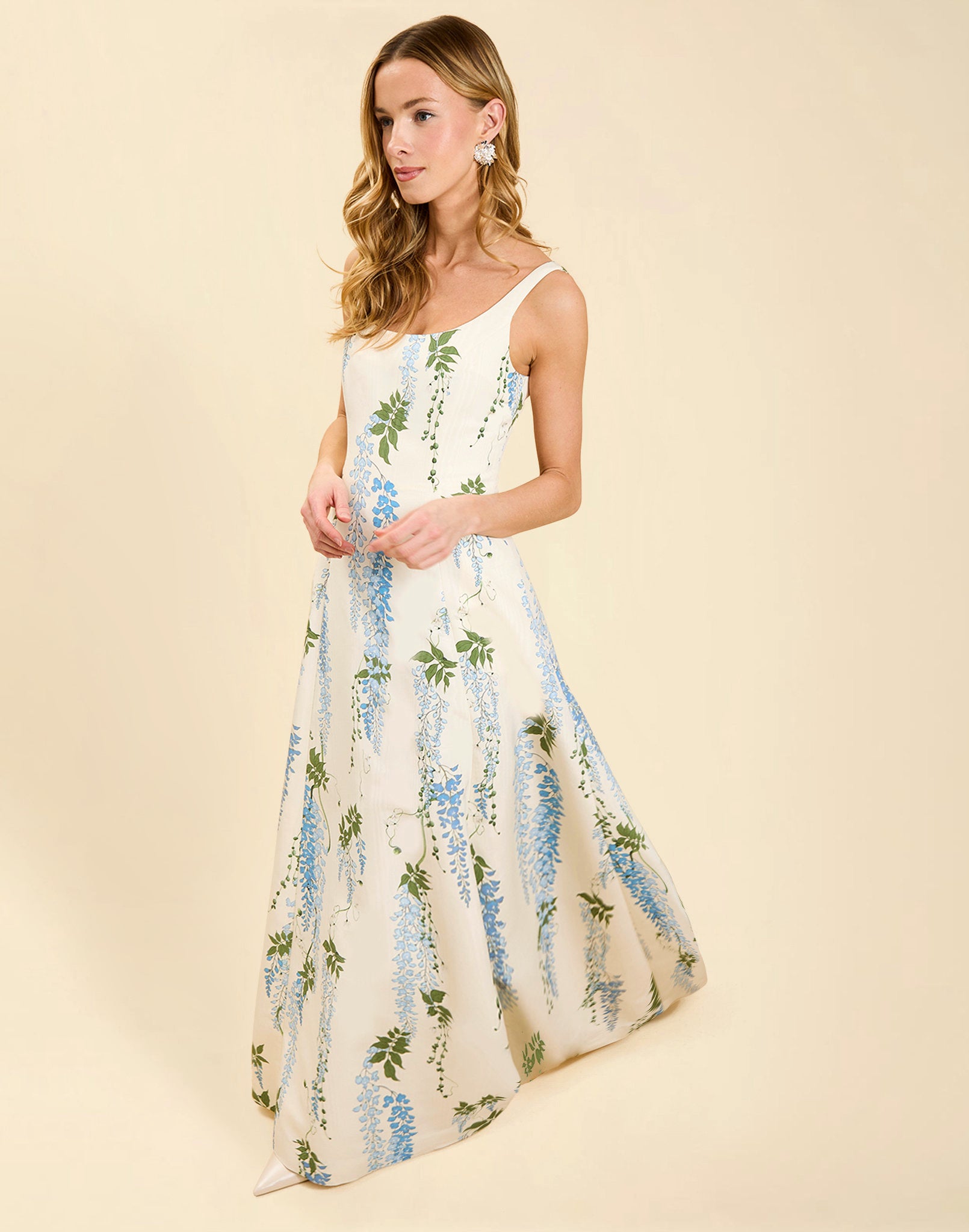 Amanda Gown in Wisteria Toile moiré with deep scoop neckline, sleeveless bodice, A-line silhouette, and hidden side pockets.