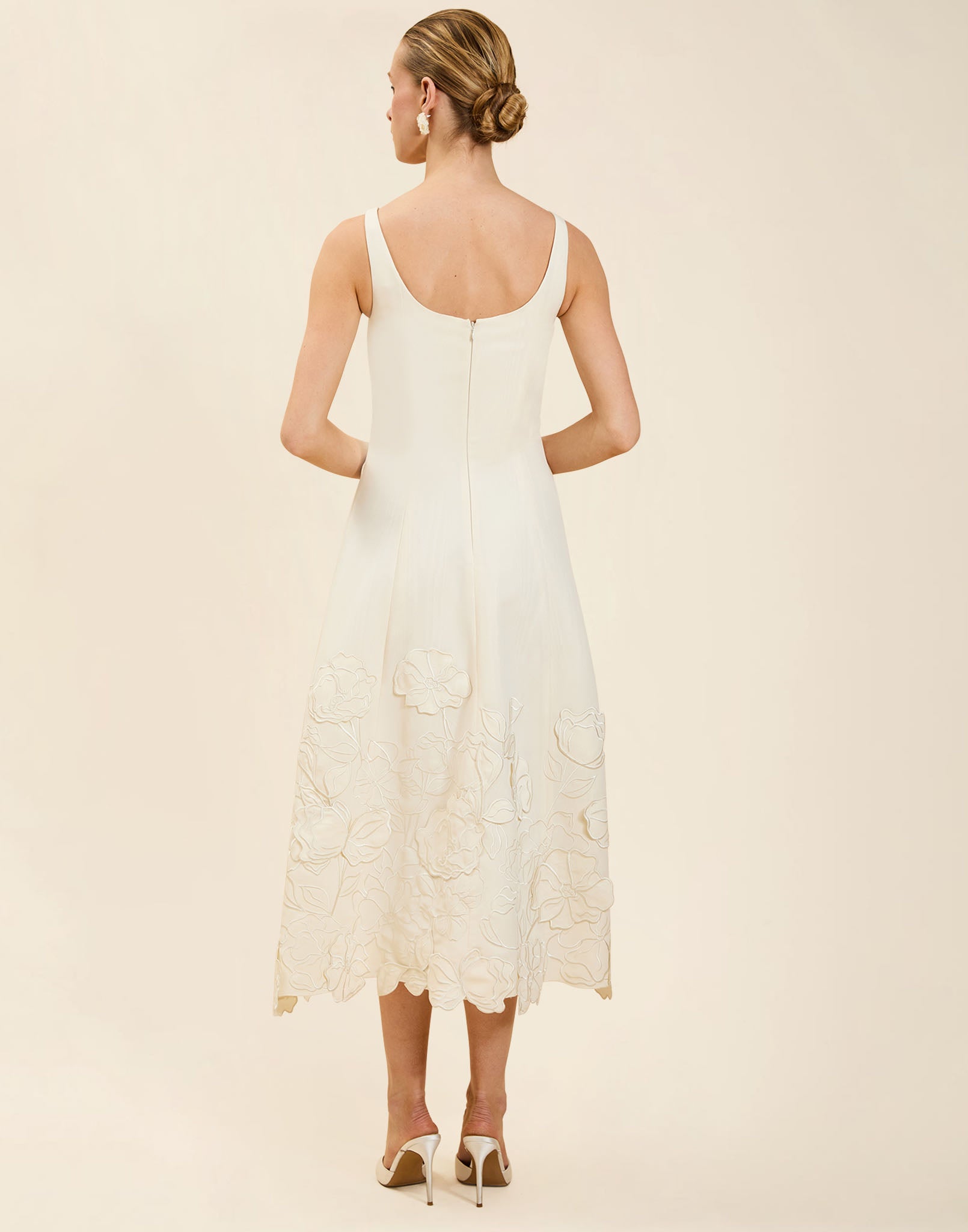 Amanda Midi Dress in Ivory moiré with tonal floral embroidery, scoop neckline, sleeveless bodice, and elegant A-line midi silhouette.