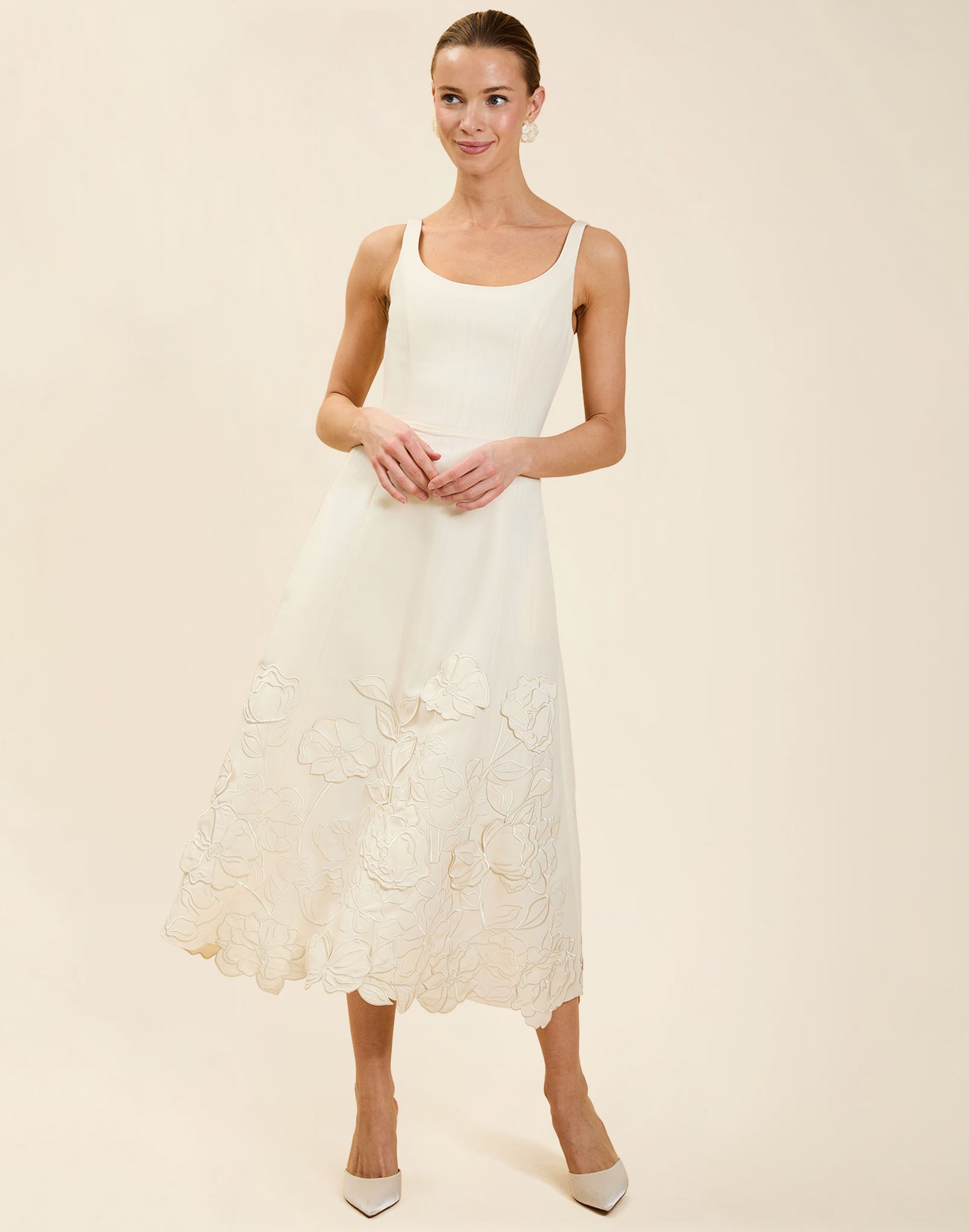 Amanda Midi Dress in Ivory moiré with tonal floral embroidery, scoop neckline, sleeveless bodice, and elegant A-line midi silhouette.