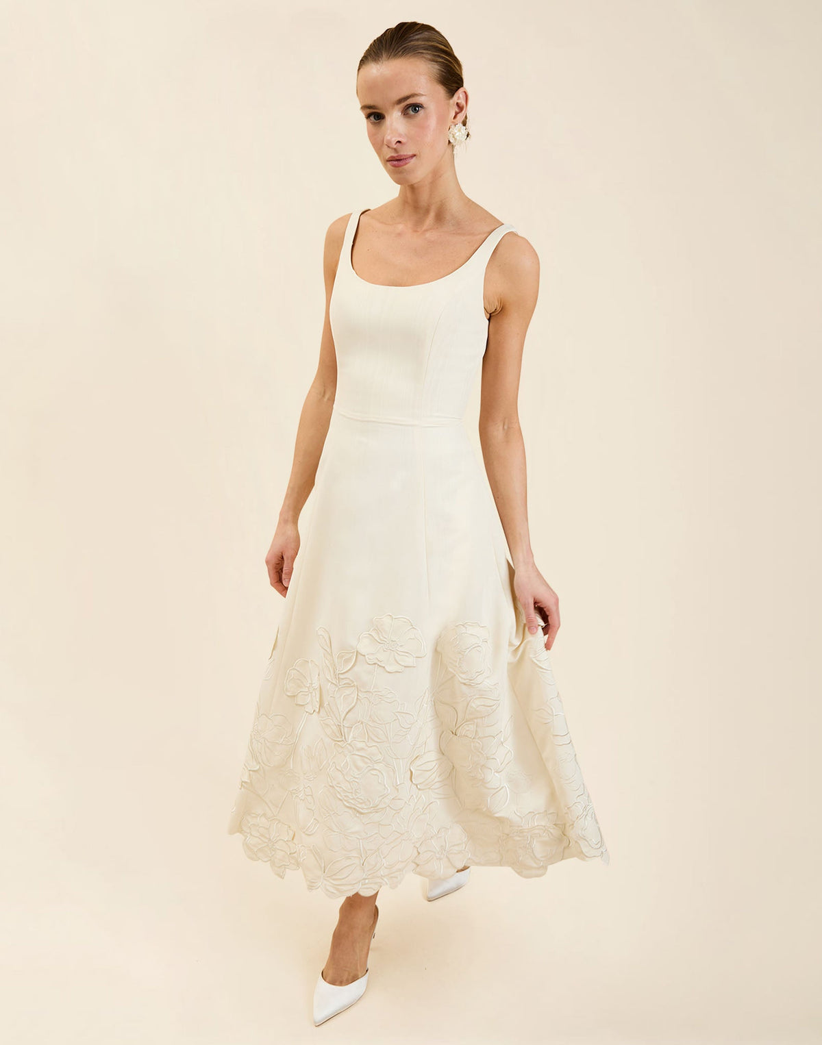 Amanda Midi Dress in Ivory moiré with tonal floral embroidery, scoop neckline, sleeveless bodice, and elegant A-line midi silhouette.