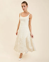 Amanda Midi Dress in Ivory moiré with tonal floral embroidery, scoop neckline, sleeveless bodice, and elegant A-line midi silhouette.