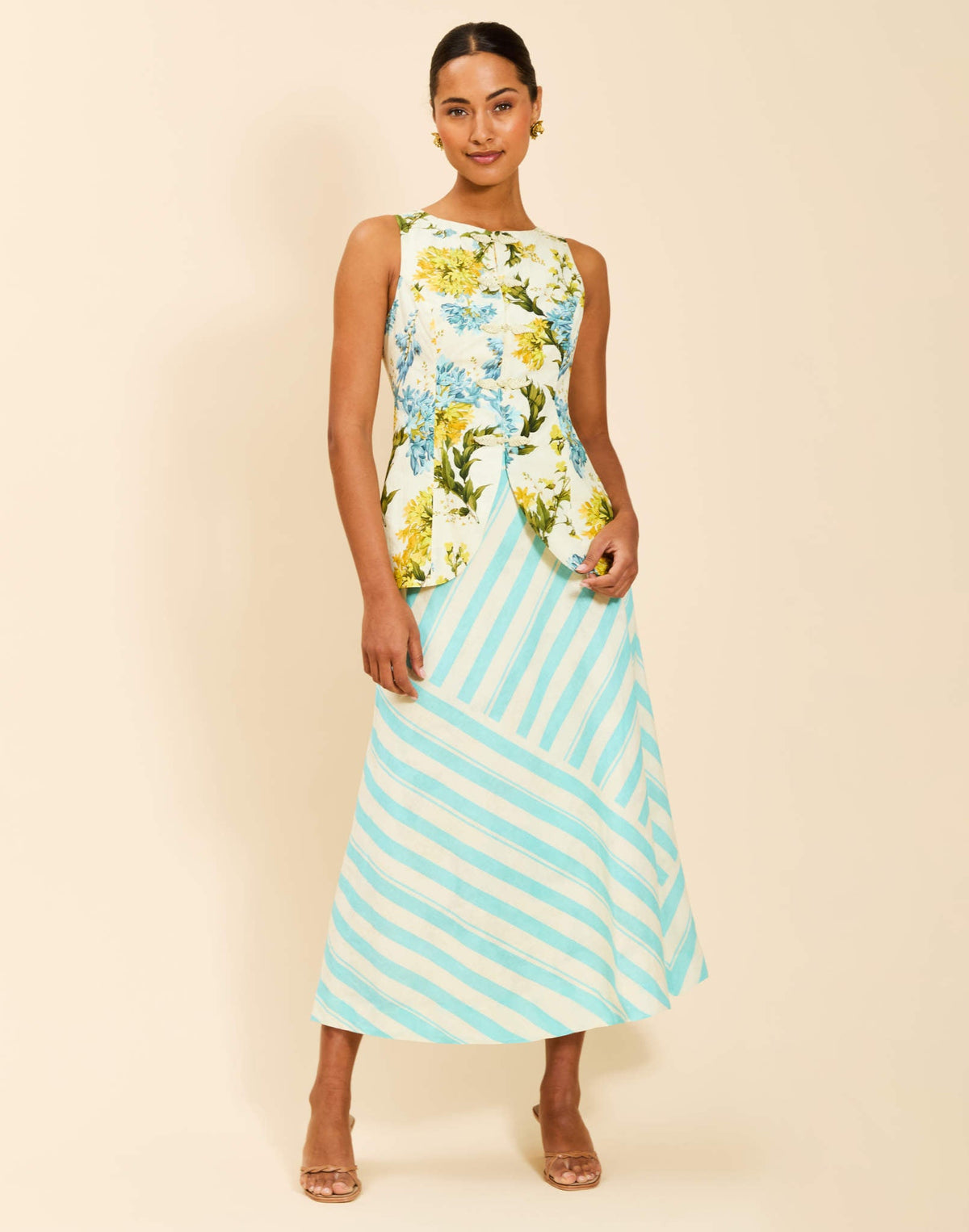 Santiago Convertible Midi Skirt in Aegean Blooms linen featuring reversible stripe and floral prints, bias-cut fabric, and subtle A-line silhouette.