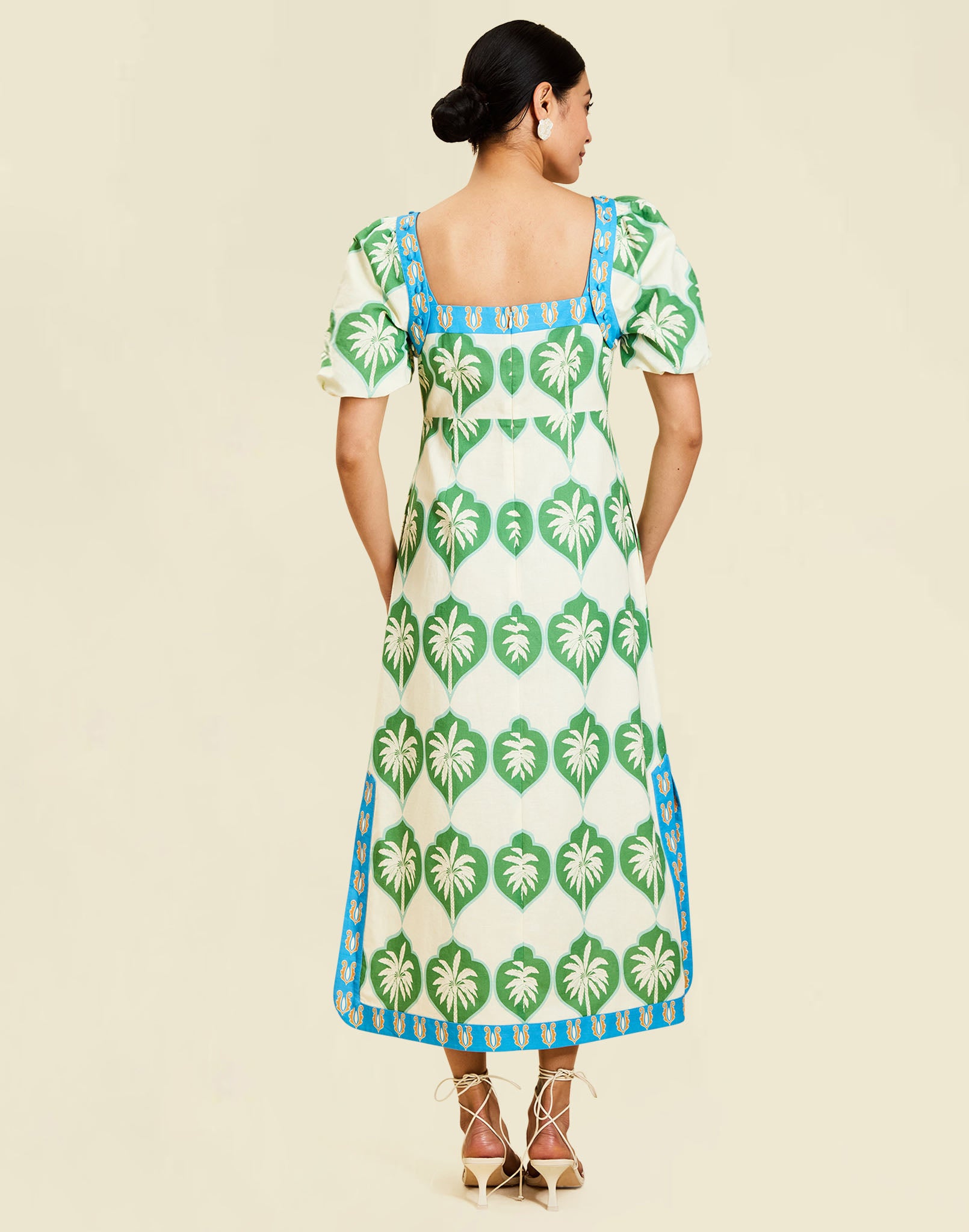 Apollo Convertible Midi Dress in Palm Bay Blue linen with square neckline, removable sleeves, and empire waist silhouette.