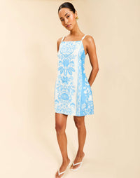 Bea Mini Dress in Florentine Blue linen organza with braided rope straps, straight neckline, shift silhouette, and side pockets.