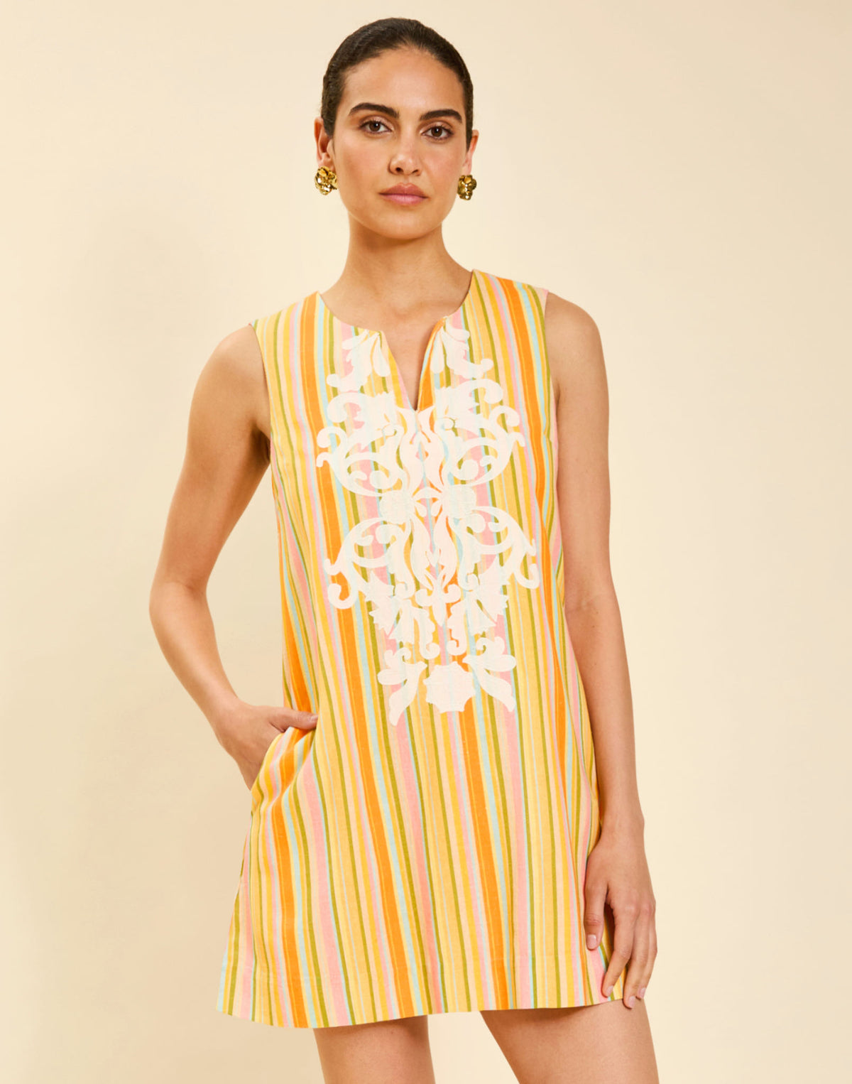 Belize Shift Mini Dress in Sunset Ribbons linen with embroidery detail, notch collar, sleeveless shift silhouette, and side pockets.