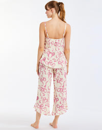 Bella Bow Pajama Set in Ivory/Pink Bows back – printed cotton pajama set with ruffle-hem tank top and pants, elastic waistband, and pockets by Mestiza New York.