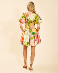 Breakfast Smocked Mini Dress in Primrose Midnight poplin with boat neckline, smocked bodice, balloon sleeves, and side pockets.