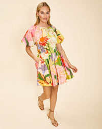 Breakfast Smocked Mini Dress in Primrose Midnight poplin with boat neckline, smocked bodice, balloon sleeves, and side pockets.