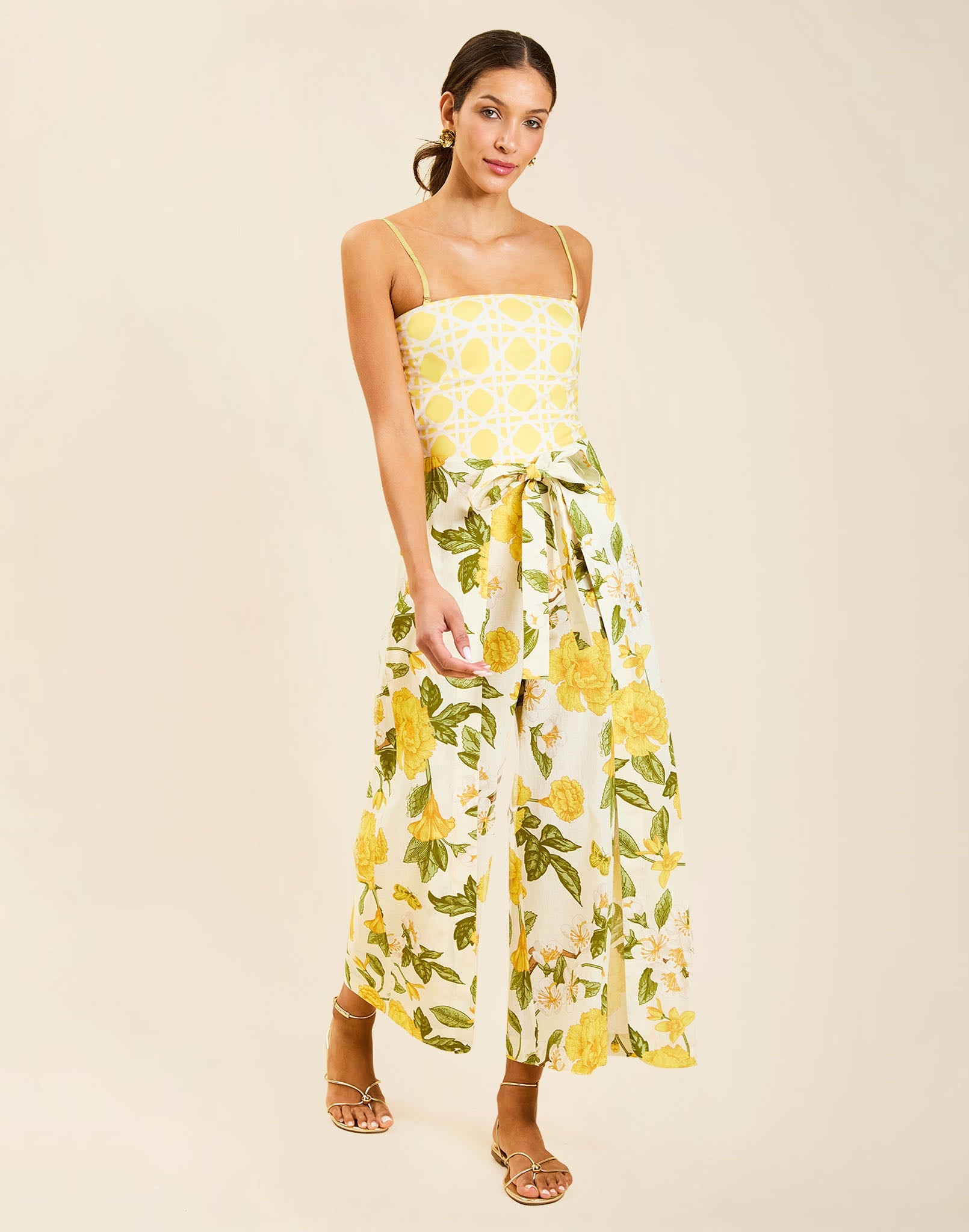 Model wearing Chloe Wrap Beach Pant in Golden Gardenia cotton-linen blend with wraparound panel and self-tie bow.