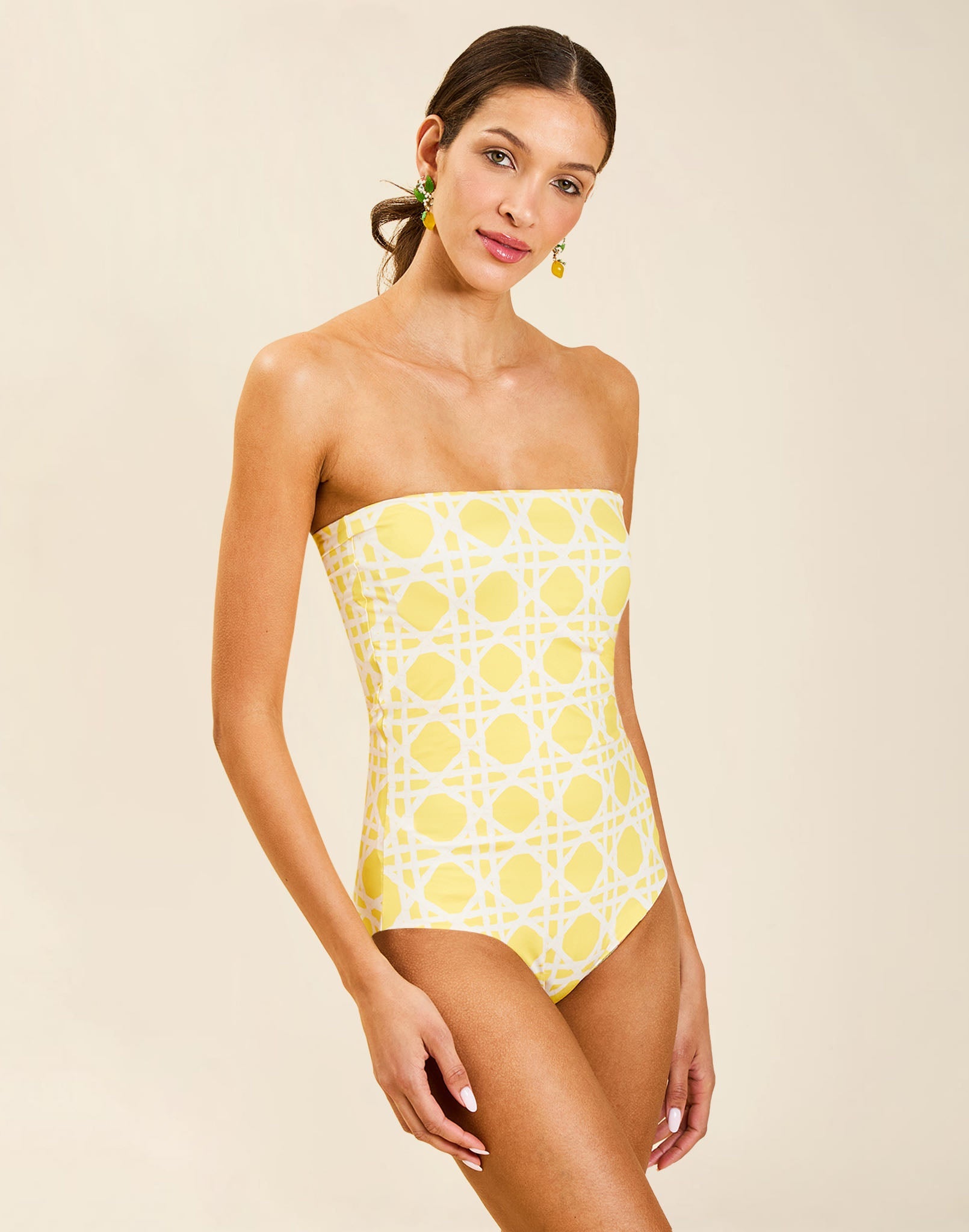 Model wearing Bria Convertible One Piece in Gardenia Lattice with removable belt and adjustable straps.