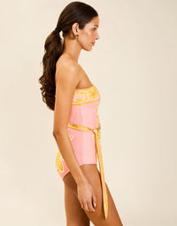 Model wearing Bria Convertible One Piece in Florentine Blush with removable belt and adjustable straps.