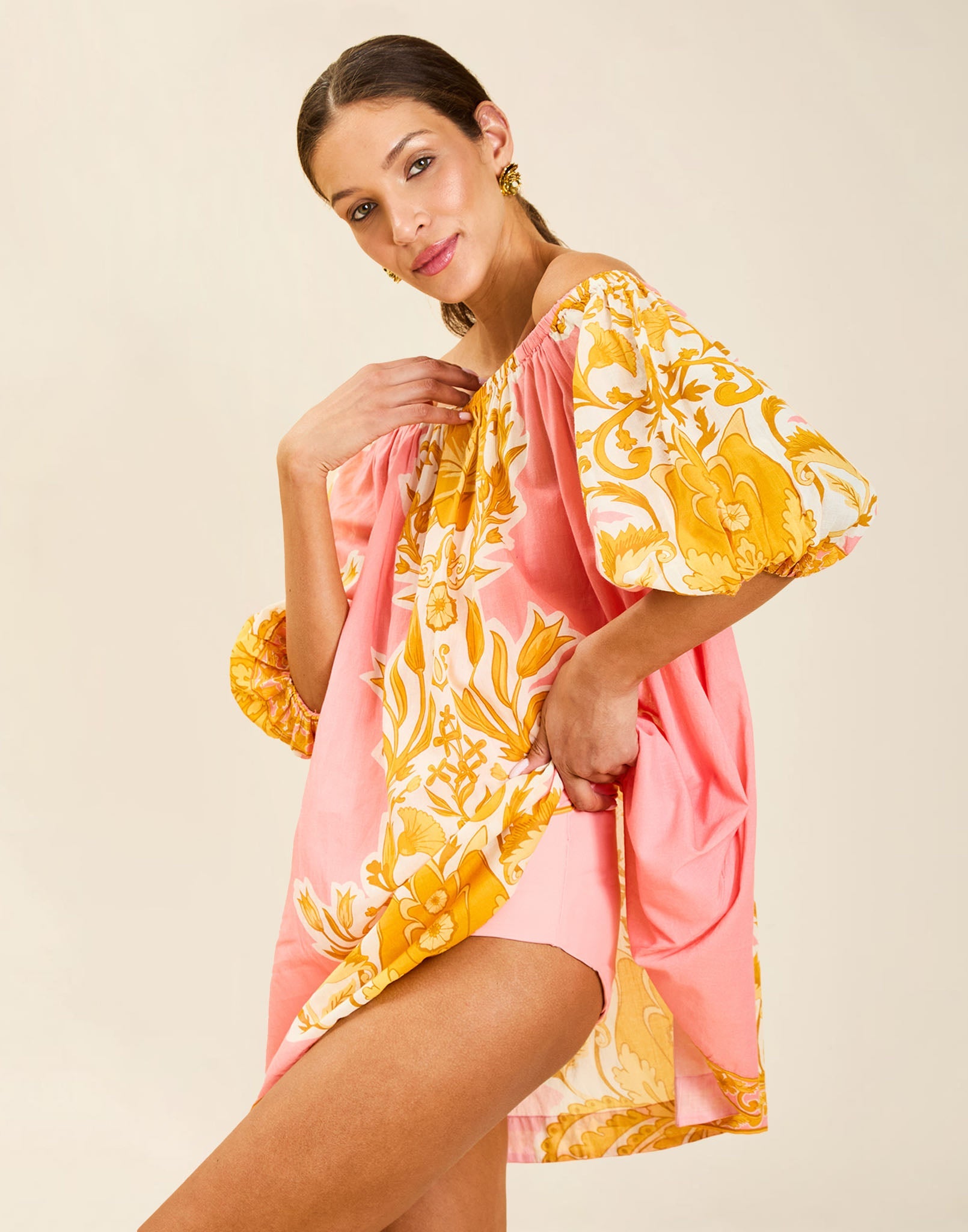 Model wearing Bria Convertible One Piece in Florentine Blush with removable belt and adjustable straps.