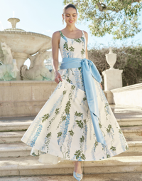 Amanda Gown in Wisteria Toile moiré with deep scoop neckline, sleeveless bodice, A-line silhouette, and hidden side pockets.
