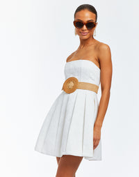 Strapless ivory jacquard mini cocktail dress with a bell-shaped silhouette and box pleats for additional textural detail.