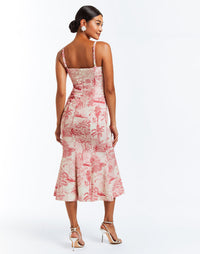 Pink and ivory toile stretch crepe fitted midi dress with flared skirt. Bow details on front below the straps. 