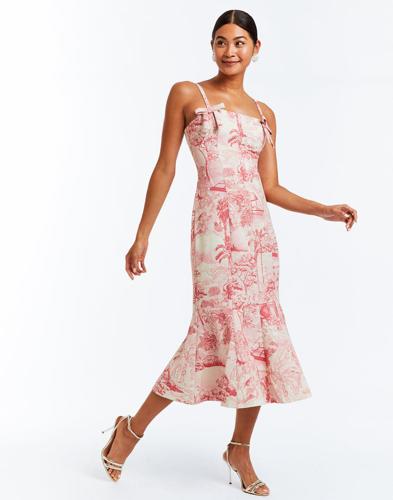 Pink and ivory toile stretch crepe fitted midi dress with flared skirt. Bow details on front below the straps. 