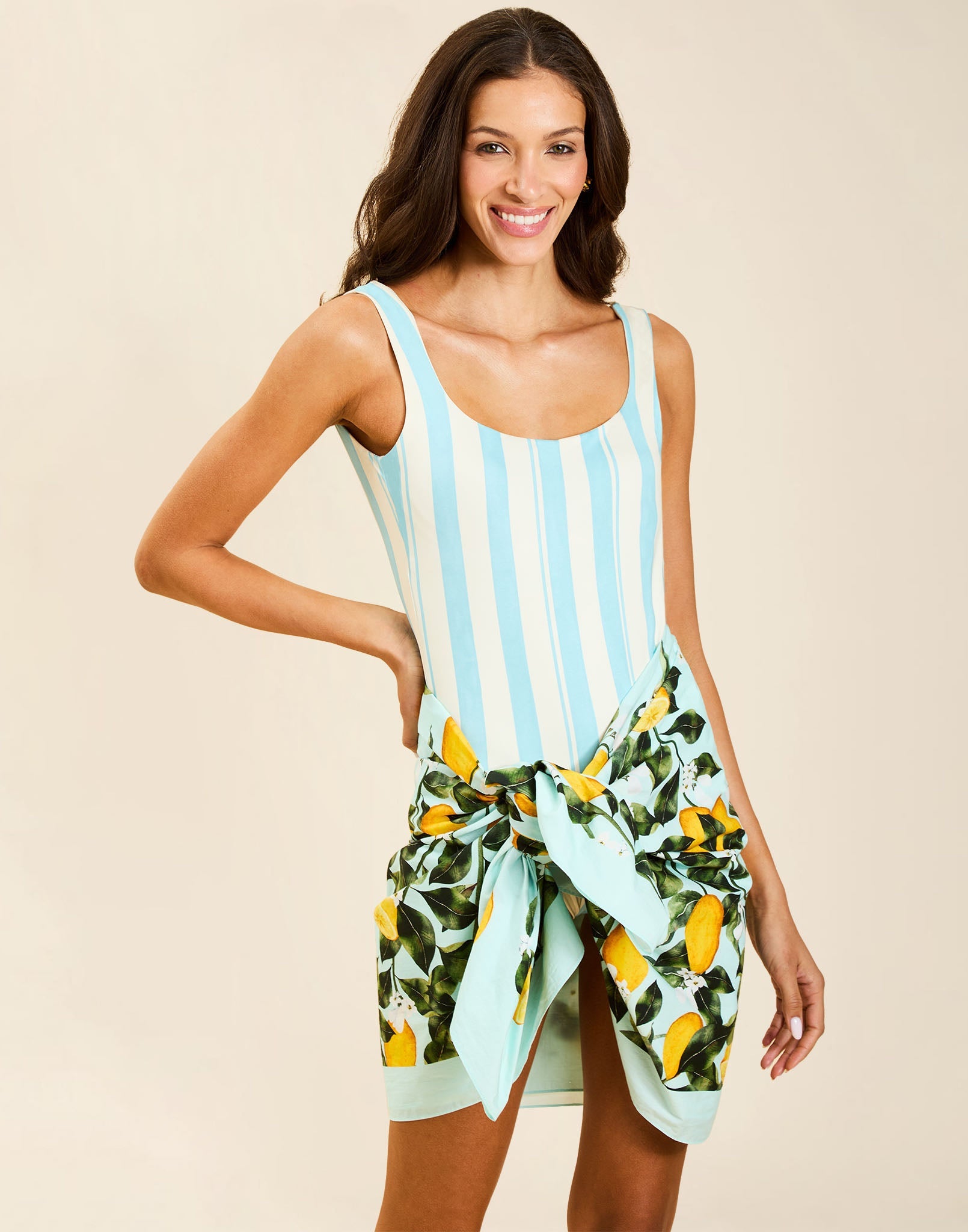 Model wearing Camille Convertible One Piece in Grotto Stripe, reversible scoop neck swimsuit with deep scoop back.