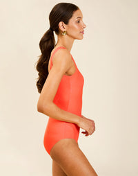 Model wearing Camille Convertible One Piece with scoop neckline and deep scoop back.