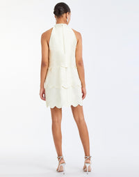 Cannes Convertible™ Mini Dress in Ivory back – cocktail mini dress with scalloped tiers, halter bow neckline, and convertible cropped top styling by Mestiza New York.