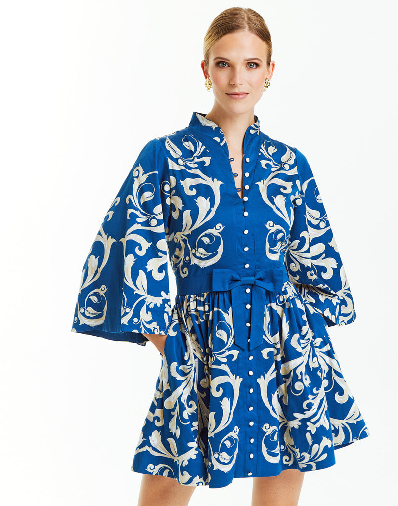 Printed blue and white cotton sateen mini dress with mandarin collar and bow belt detail