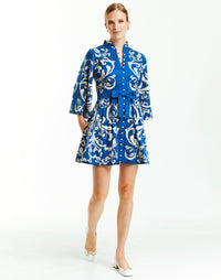 Printed blue and white cotton sateen mini dress with mandarin collar and bow belt detail